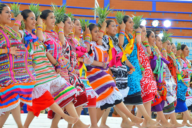 Flor de piña dancers in traditional Oaxacan costume performing at Guelaguetza del Tule festival from San Juan Bautista, Tuxtepec